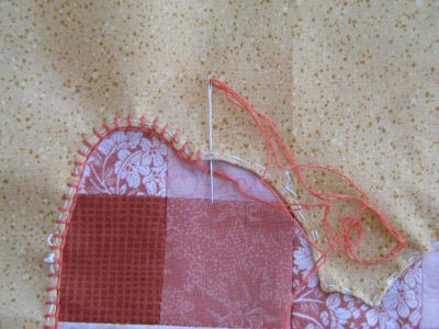 Blanket Stitch the Heart Shape to the smaller square.