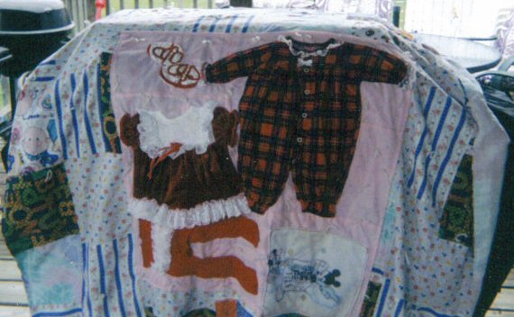 Quilt with Baby Clothing...What a Treasure!